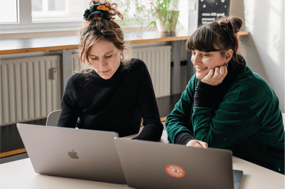 Two female developers sitting at a table